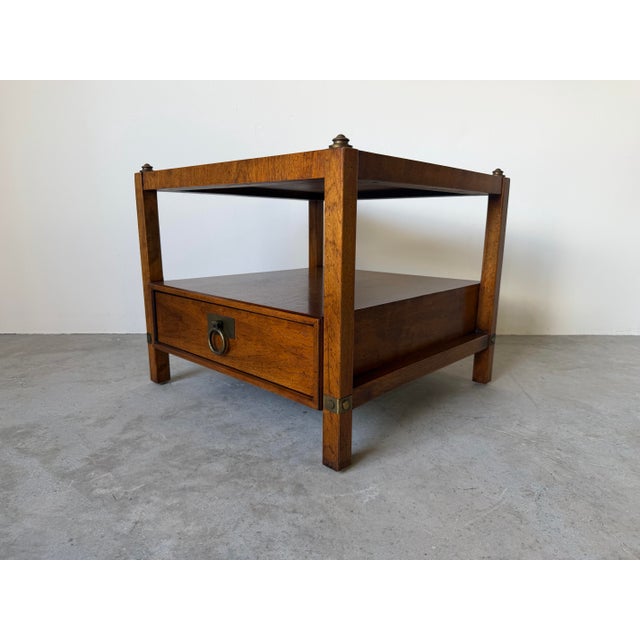 Beautiful pair of vintage Henredon end tables featuring complementary hexagonal and square forms with elegant brass...