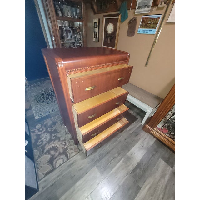 Art Deco Waterfall Highboy Dresser. 1930's to 1940's. Solid hardwood drawers. Original hardware, finish, and woodwheel...
