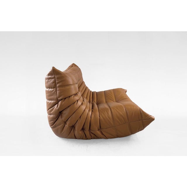 A vintage Togo Lounge Chair by Michel Ducaroy for Ligne Roset, designed in France in 1973. This iconic all-foam lounge...