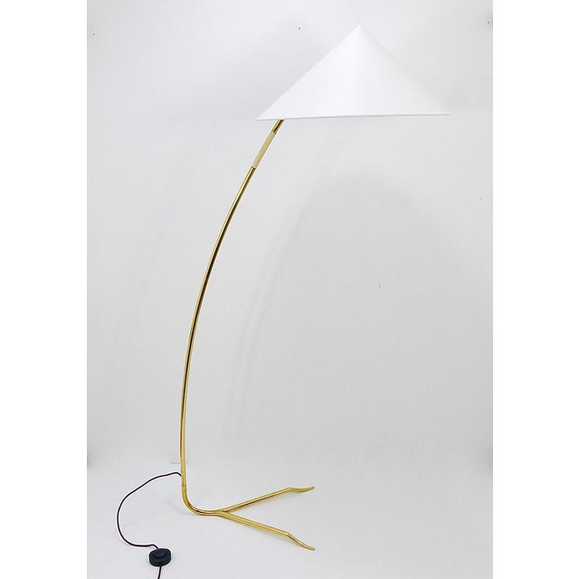 An elegant and exquisite Austrian Mid-Century floor lamp dating back to the 1950s, designed and crafted by Rupert Nikoll...