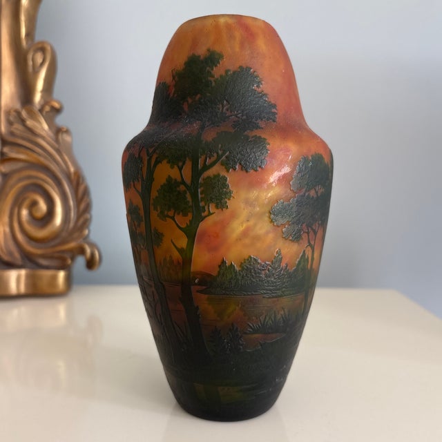 Beautiful Daum Nancy Cameo glass vase depicting a forest and lake. Featuring a stunning background of mottled red , yellow...