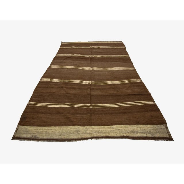 Vintage handwoven wool kilim rug from Kars region of Turkey. Approximately 50-60 years old. In very good condition