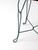 This vintage mid-century bistro table pairs a warm round wood top with a wrought iron base in a deep green tone. The...