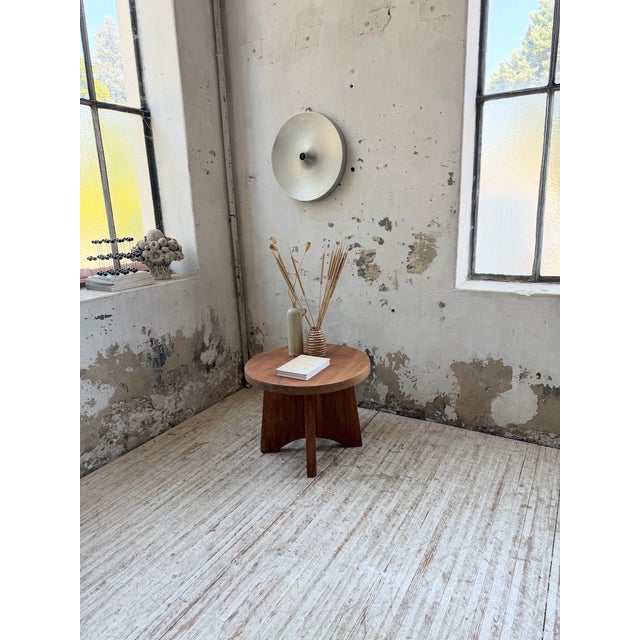 Small pedestal table or constructivist side table from the 1950s in mahogany. We love its simple lines and thick, round...