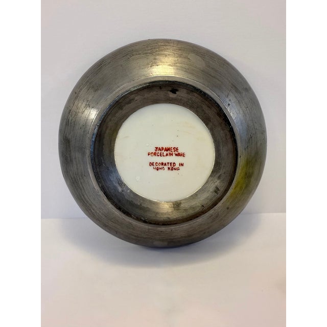 This beautiful bowl from the late 20th century was carefully crafted in Japan and hand-painted in Hong Kong as noted by...