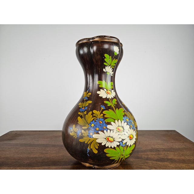 Vintage ceramic vase with floral decorations. Normal signs due to age and use.