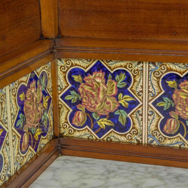 This is a good Edwardian washstand, made to go in a corner. Made from mahogany and with unusually attractive tiles. The...