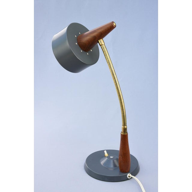 An elegant and highly functional danish table lamp produced by lyfa during the 1960s, combining the warm natural materials...