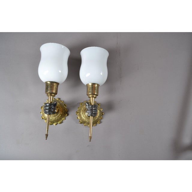 Seven-piece French Art Deco style bathroom fixture set from the 1930s in bronze and brass with sculptural fist motifs. The...