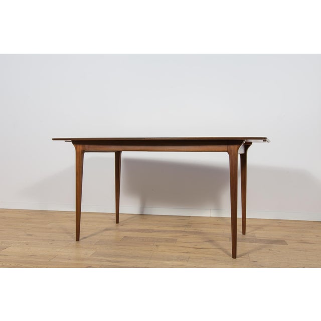 The table produced in the 1960s in Scotland by A.H. McIntosh. The table with a light form, with profiled legs. This is...