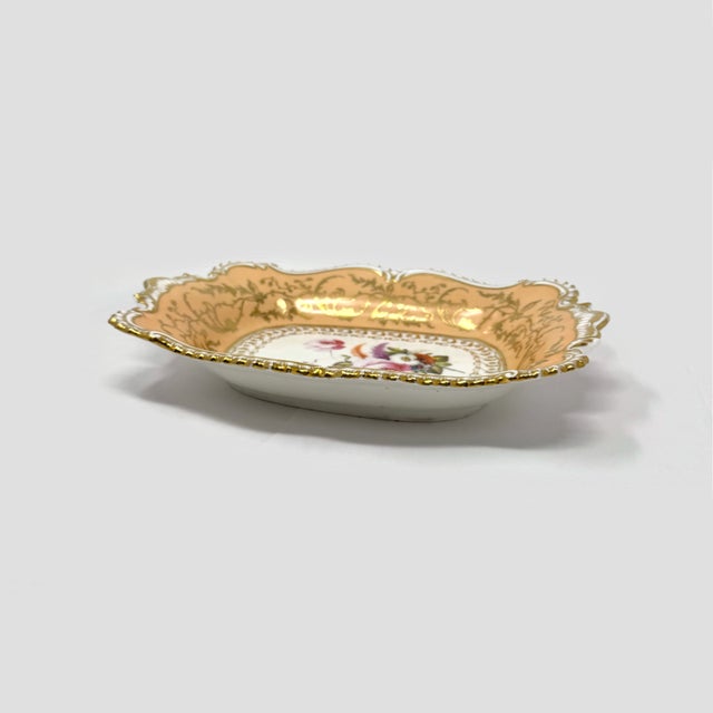Add timeless elegance to your collection or home decor with this exquisite antique porcelain serving dish. Featuring a...