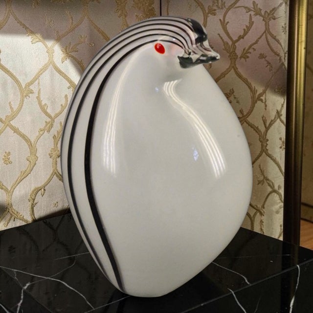 This vintage art class figurine features a penguin design attributed to Murano, Italy. Handmade from black, white, and red...