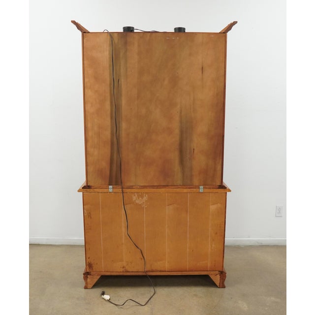 This vintage Colonial Revival china cabinet by Tell City Chair Company showcases the brand’s renowned craftsmanship and...