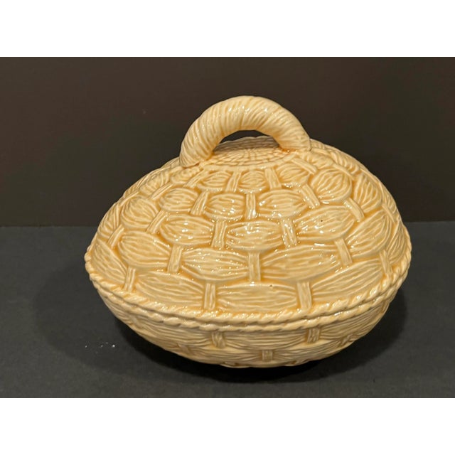 A basket wave design adds charm to this handled, egg-shaped covered dish. Perfect for your Easter table or anytime. It is...