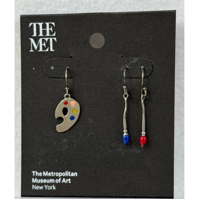 New, unworn “ Paintbrush and Pallet” earrings with original card stock and pamphlet from The Met, Metropolitan Museum of...