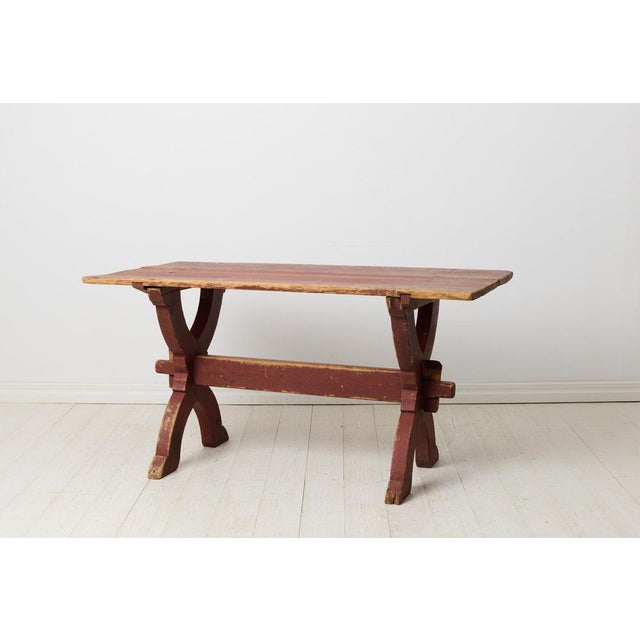 Early 19th century dining table or work table from Sweden. This antique table is a genuine trestle table from northern...