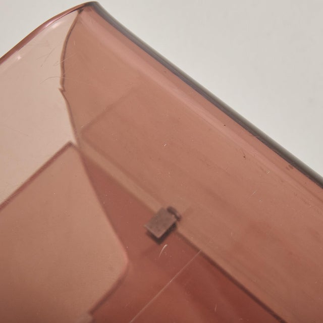 A sculptural 1970s French bar cart or record trolley attributed to Michel Dumas for Roche Bobois. The 3-tier silhouette is...