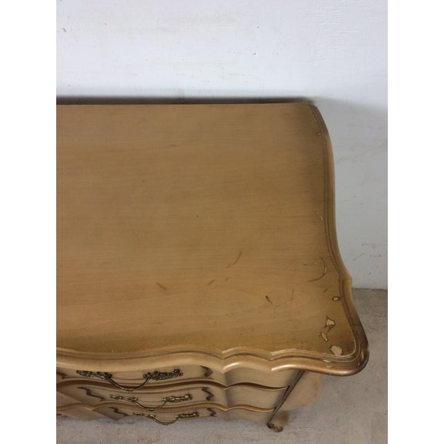This mid century French Provincial style lowboy dresser by. Huntley Furniture Company features hardwood construction,...