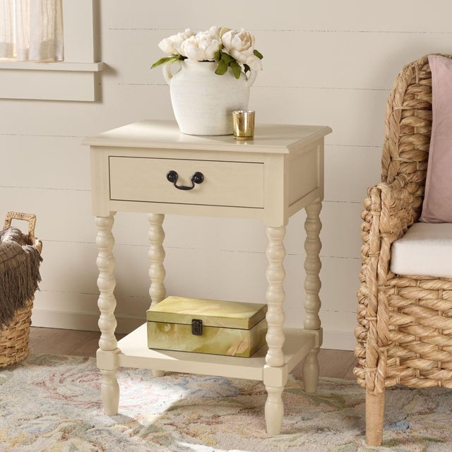 Classic farmhouse charm meets contemporary decor in this Athena Accent Table. Athenas modernized ball-turned legs are...