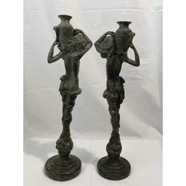 Magnificent pair of verdigris nymphs, a boy and girl statues carrying urns on their shoulders. Wonderful detail - the...