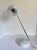 Here is a stylish 1990s Tensor task lamp featuring a classic eyeball shade, crisp white finish, and polished chrome...