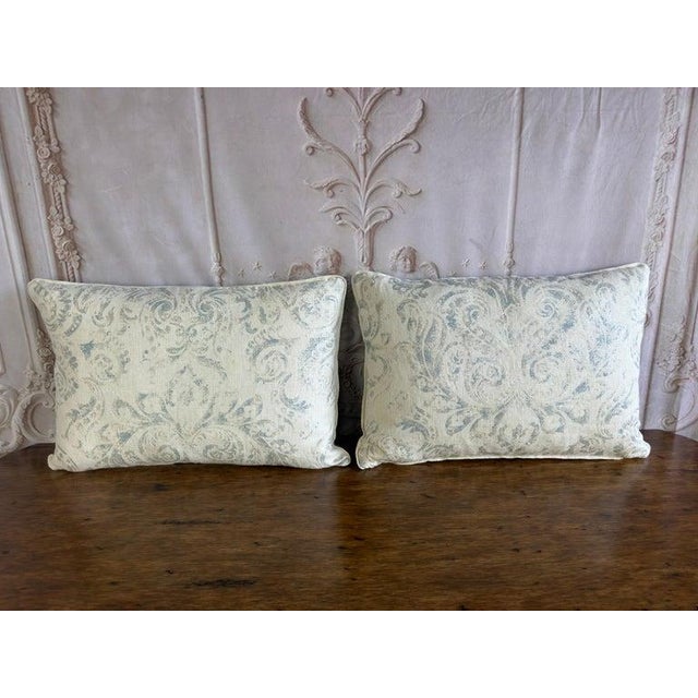 A pair of serene and sophisticated custom printed lumbar pillows that capture the ethereal charm of Swedish Gustavian...