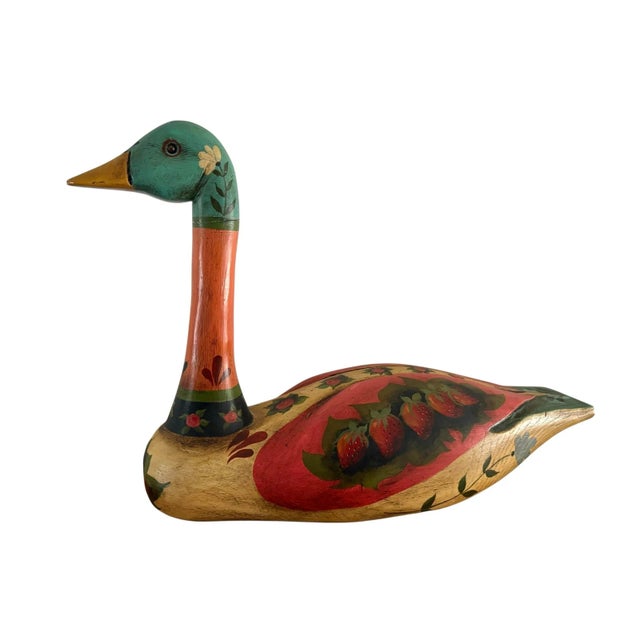 Vintage Folk Art colorful wooden duck or swan statue. Hand painted with florals and fruit. Vibrant colors adorn this...