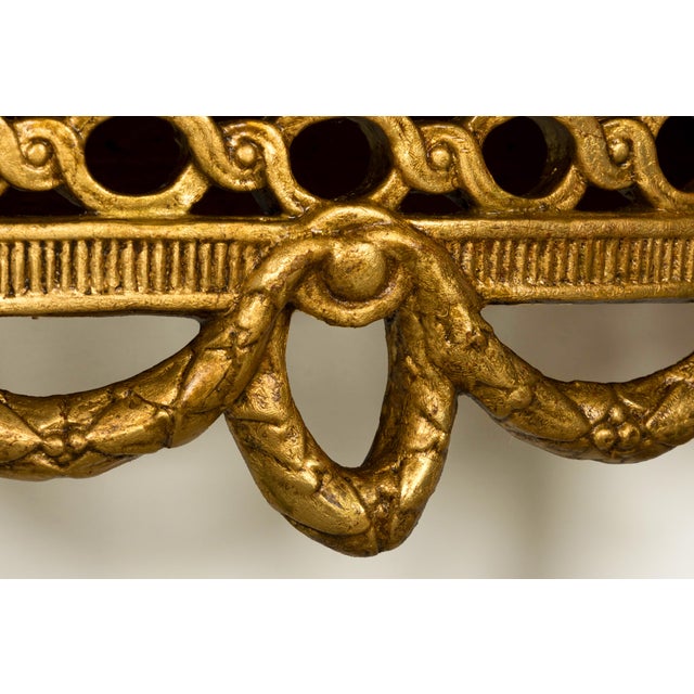 Sourced in Provence, France, this exceptional pair of late 18th-century French Louis XVI giltwood demilune console tables...