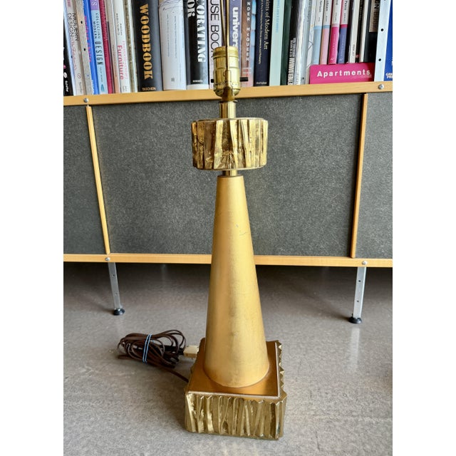 Heavy brutalist designed metal lamp with cast metal top and bottom and Italian gold leaf center. Piece is attributed to...