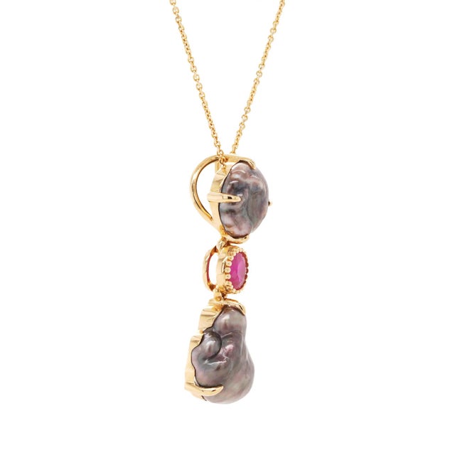 This pendant highlights the beauty of contrast: the organic texture of Tahitian pearls set against the vivid sparkle of...