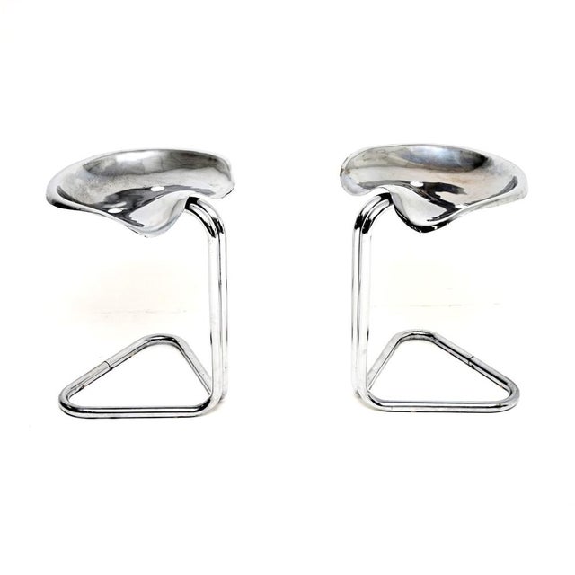 A stylish and iconic pair of Vintage tractor stools by Rodney Kinsman for OMK. They were made in England, they date from...