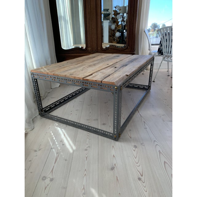Here we have a large rustic coffee table made from salvaged timber beams, vintage industrial slotted steel angle and old...