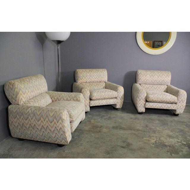 Missoni style fabric armchairs and 70s wooden legs
