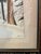 Tall and narrow wood frame matted Picture. The frame measuring 16.75” by 33.5” Tall. The back is handwritten marked “ How...