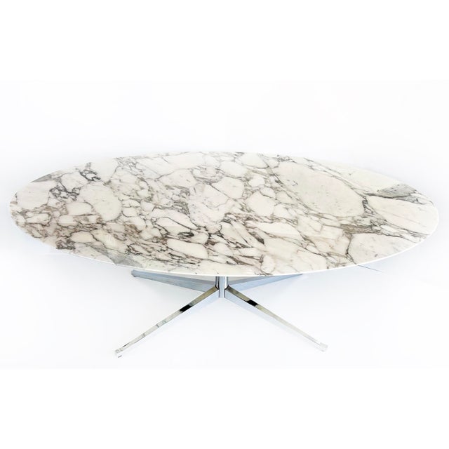 Florence Knoll Oval Carrara Marble Dining Table, Signed Stainless Steel Base Offered for sale is a Florence Knoll...