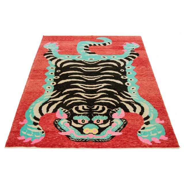 This beautiful handmade Turkish Art Deco wool rug has a red field. In a stunning tiger pictorial design, it features...