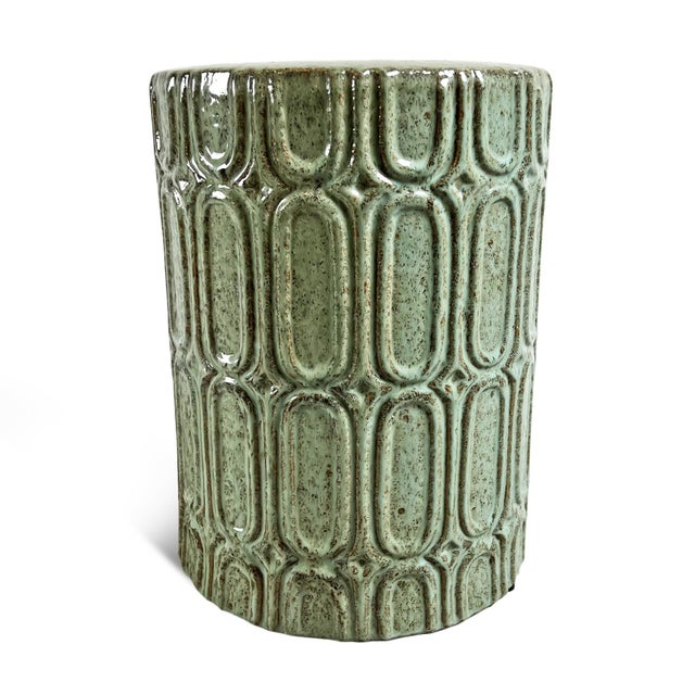Ceramic minty green garden stool with fun deco design and brown speckles. Great for use outdoors for unique extra seating...