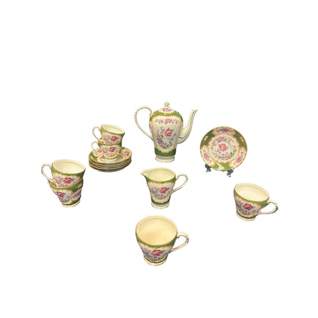 Elegant Royal Grafton Tea Set - features 1 teapot, 1 creamer, 6 demitasse cups and 6 saucers. This pattern features...