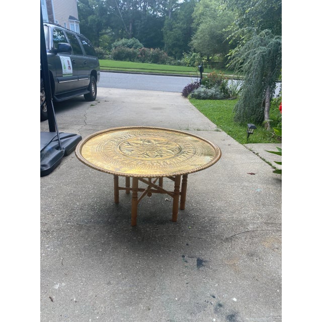 This is a beautiful brass metal and wooden dining tables with hand made details on the top of the table. Perfect for the...
