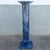 Striking vintage Postmodern pedestal featuring a dramatic faux blue marble finish with rich navy, black, gray, and white...