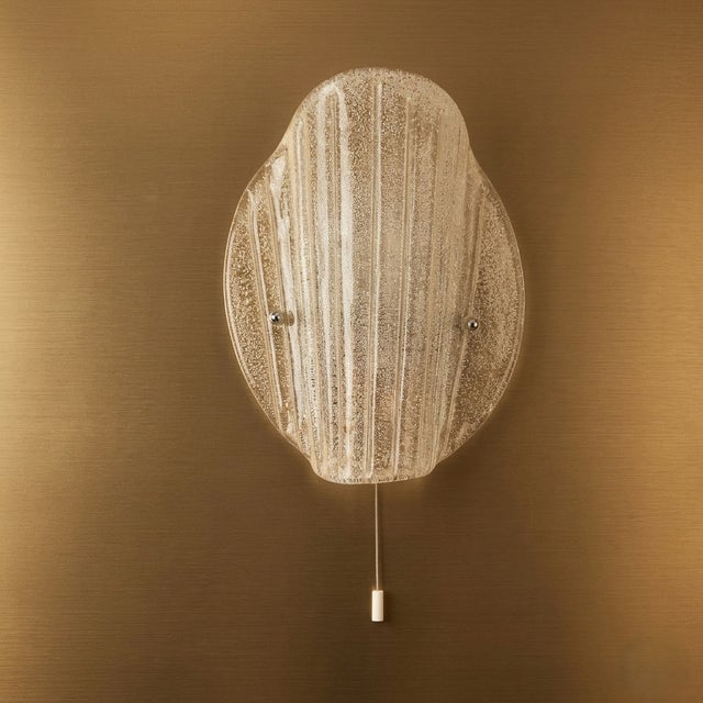 Textured Murano ice glass produced by Fischer Leuchten, creating a sparkling, ice-like play of light when illuminated. The...