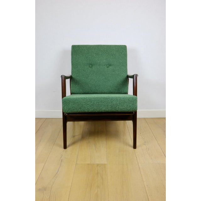 PRL armchair "Stefan" made of wood, vintage style, green boucle fabric - 2 pieces available. The "Stefan" Vintage Armchair...