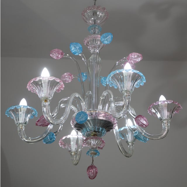 Inspired from the city of Amsterdam. Elegant vintage Murano chandelier decorated with pink and blu tulips in Murano Glass....