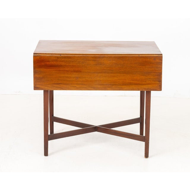 George III Style Mahogany Pembroke Table, with single frieze drawer and brass ring handle on four tapered legs conjoined...