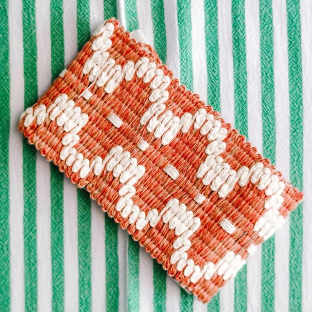 She skipped up the steps of the ancient Greek temple, a vision in decadent prints and patterns in a sea of tired white...