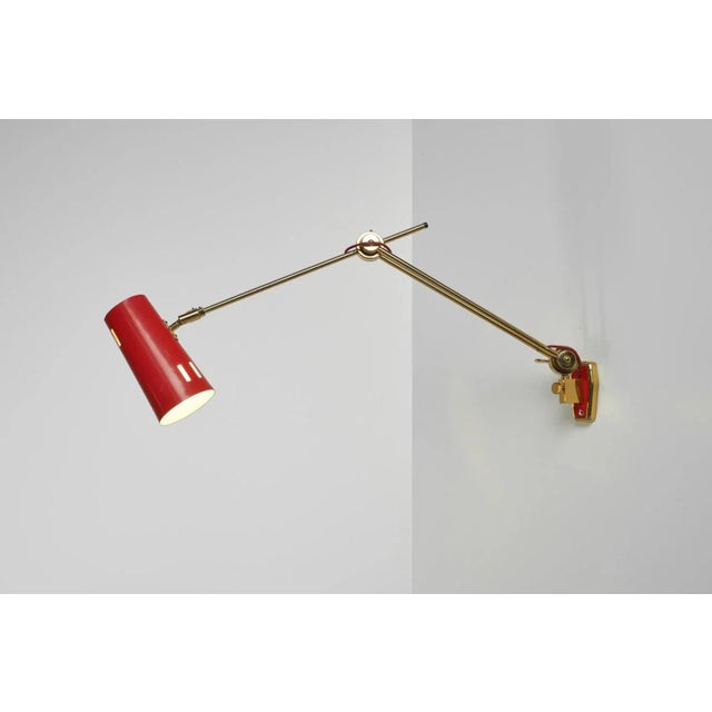 Stunning fully adjustable wall lamp designed and manufactured by stilnovo, italy 1960. The lamp has a super quality solid...
