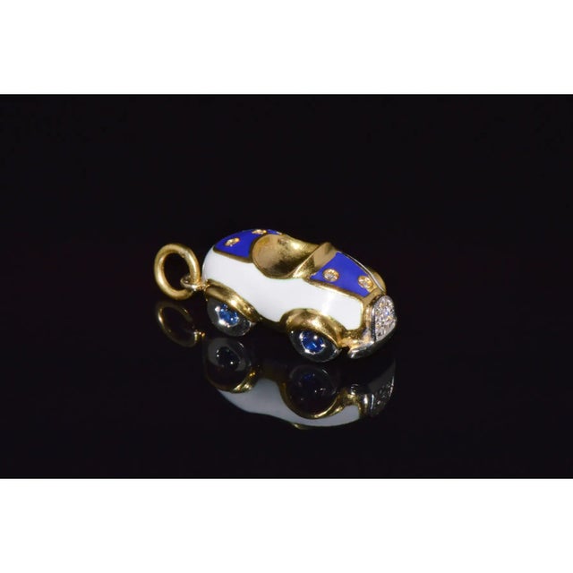 This authentic Aaron Basha Car charm pendant is crafted in solid 18K yellow and white gold with glossy white and royal...