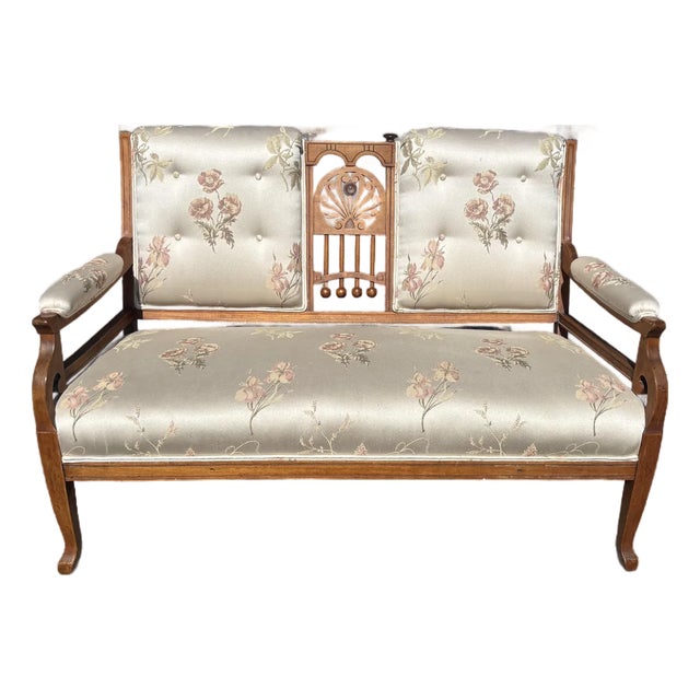 Late 19th Century Attributed Eastlake Walnut Settee with Pink Floral Upholstery For Sale