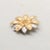 This is part of Chairish’s Costume Jewelry assortment. 1960s goldtone & rhodium plated sunflower brooch with security...