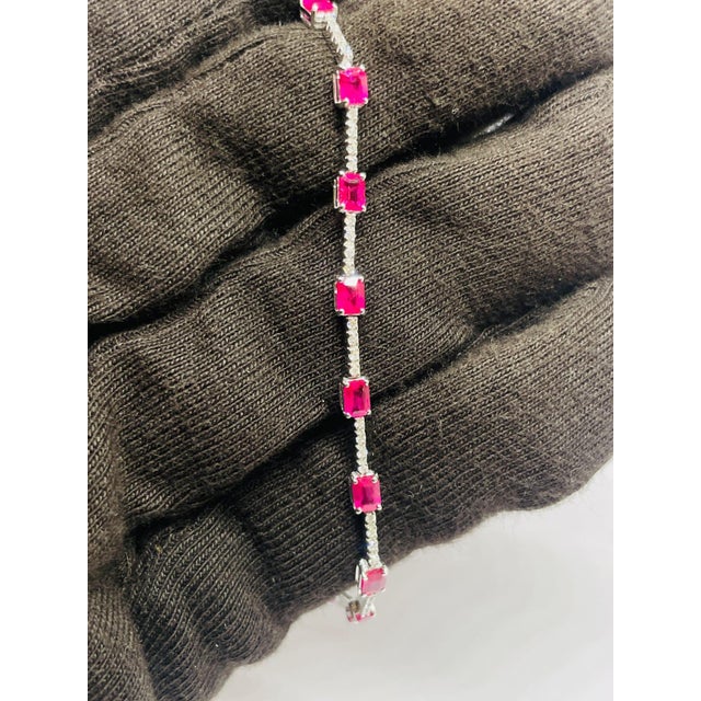 GEMSTONE DETAILS Gold Purity: 18K Solid Gold (stamped) DIAMOND: 0.39 CTS RUBY: 3.71 CTS 18K GOLD GROSS WEIGHT: 6.90 GRAMS...